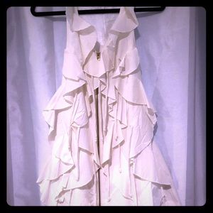 Sleeveless top with dramatic flare